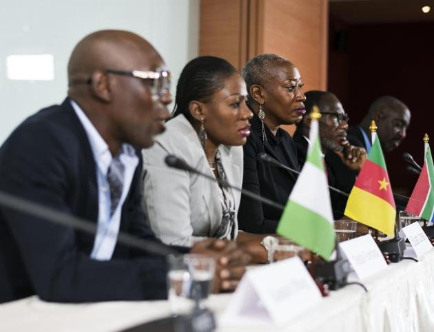 Internation Business People in a Panel Discussion